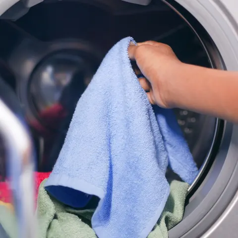 Laundry tumbling inside a washing machine